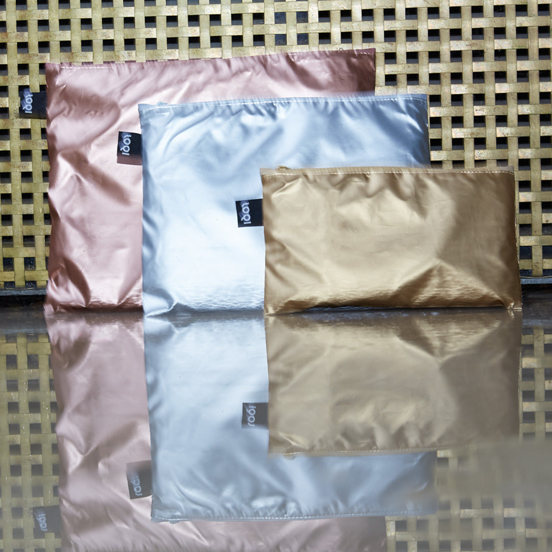 Tasche con zip in oro, argento e oro rosa